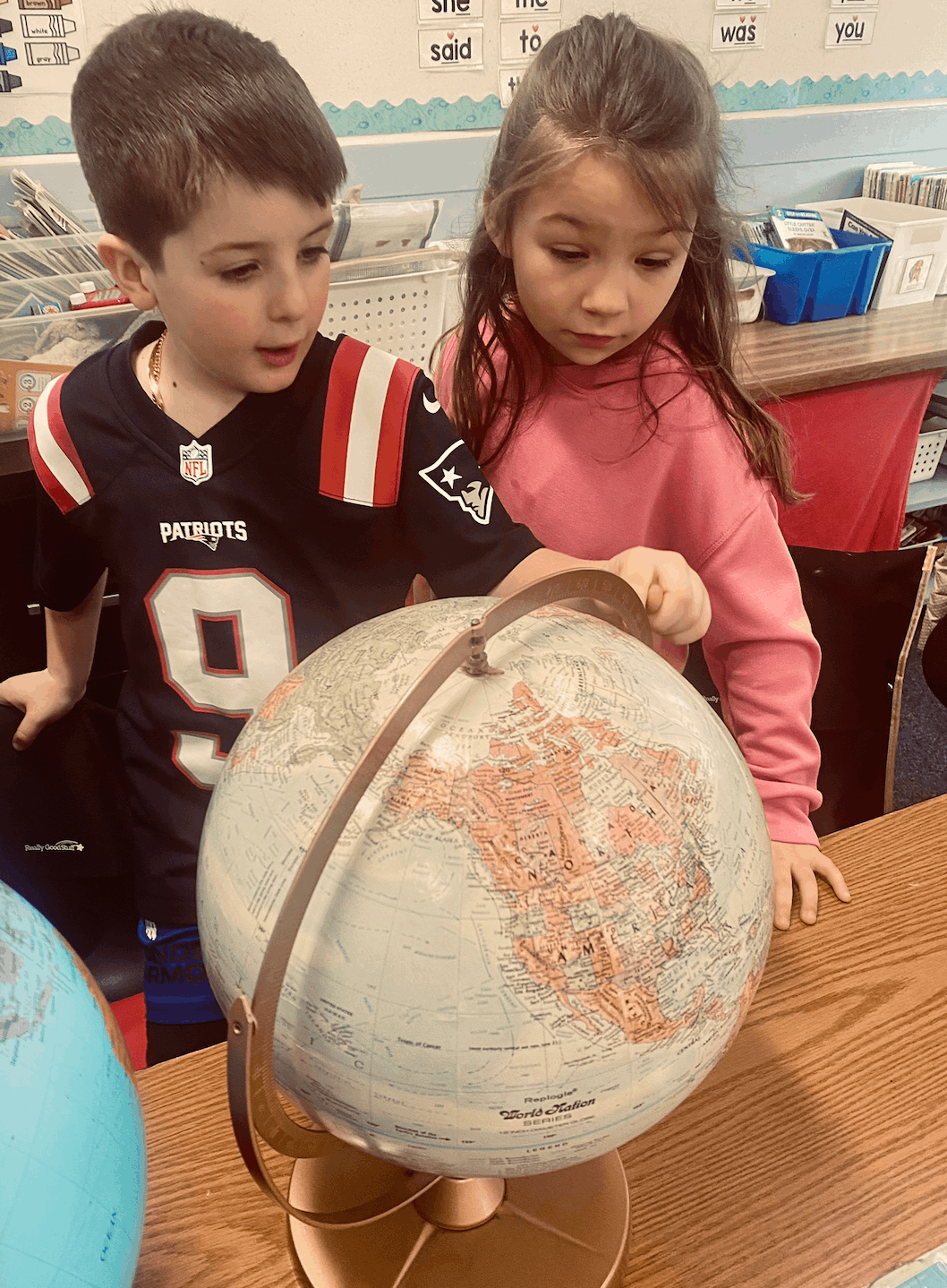 Gr. 1 Students Study Globes, Maps, and Atlases